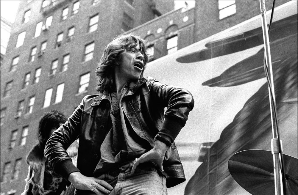 The Rolling Stones promote their Tour of The Americas by playing "Brown Sugar" on a flatbed truck in Greenwich Village. Mick Jagger struts his stuff 1975 (Allan Tannebaum)